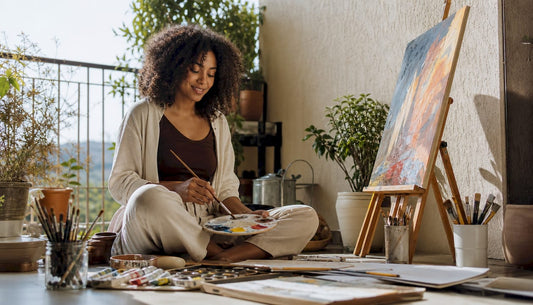 Woman painting in cozy living room
