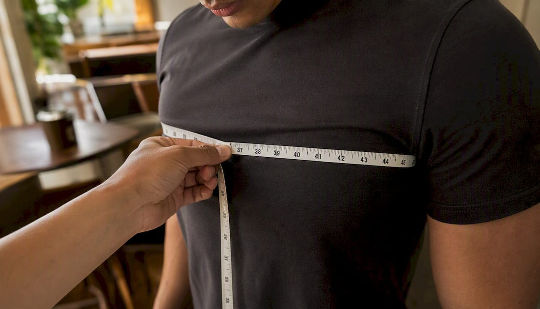 Measuring chest with tape in streetwear shirt