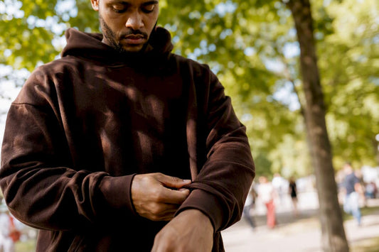 Close-up of streetwear hoodie sleeve being adjusted