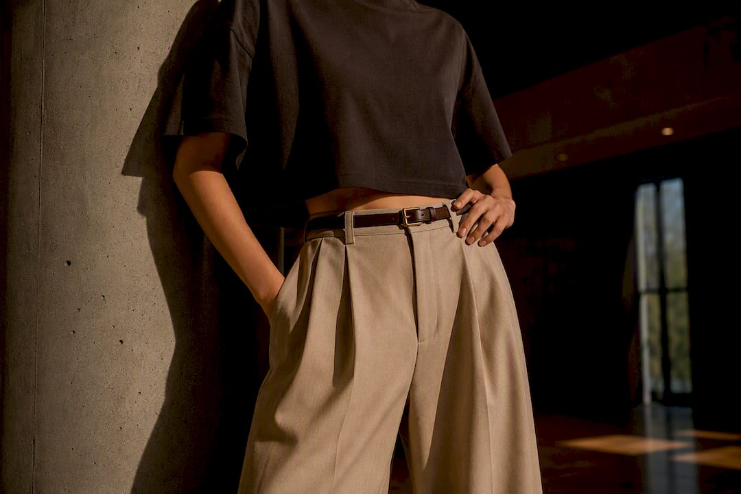 Cropped tee styled with high-waist trousers