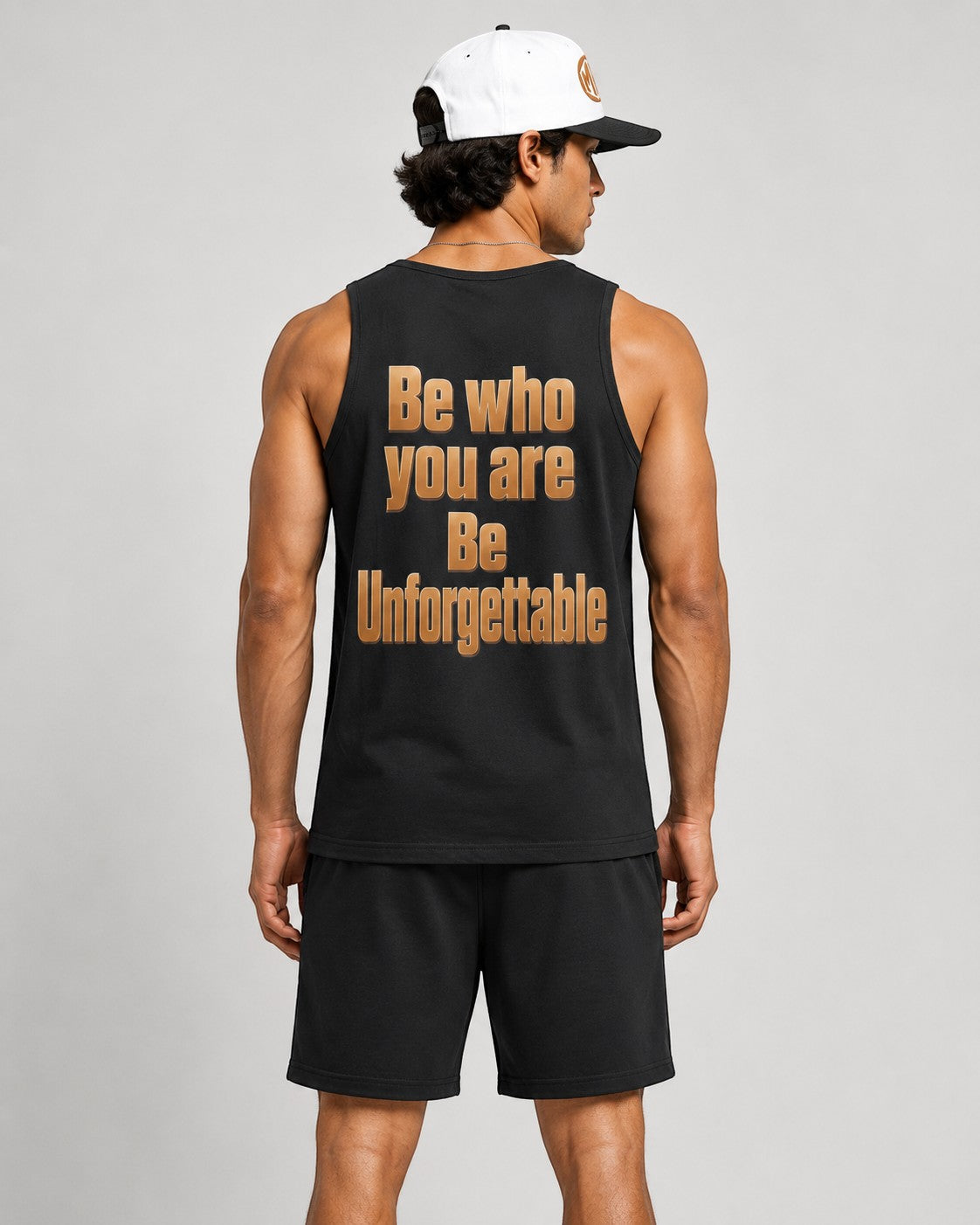 MR. HAPPINESS black 100% combed cotton oversized muscle tank with gold text graphic on back.